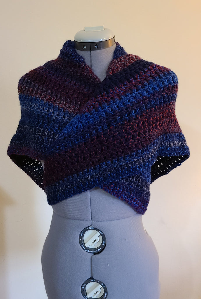 Front view of triangular shawl with maroon and navy blue stripes.