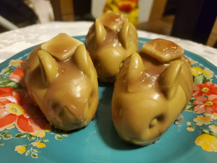 Soap in the shape of a bunny, the color of a cooked pancake, with a square of butter and syrup on top, all made of soap.