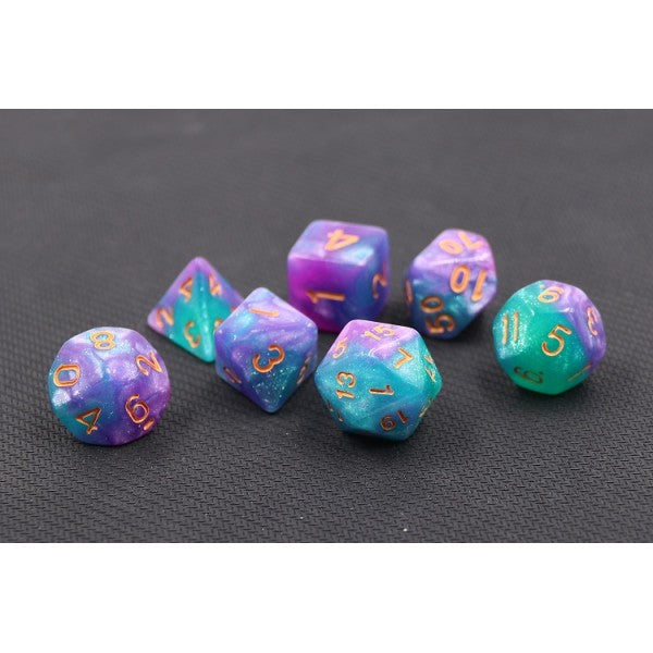 A tabletop dice set in in a swirling combination of sparkling light blue, purple, and magenta, with gold numbers.