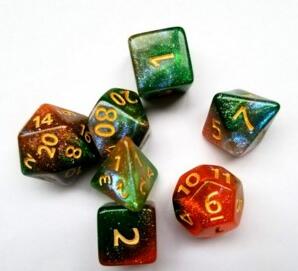 A tabletop dice set in a gradient of colors including gold, red, and green, with gold numbers.