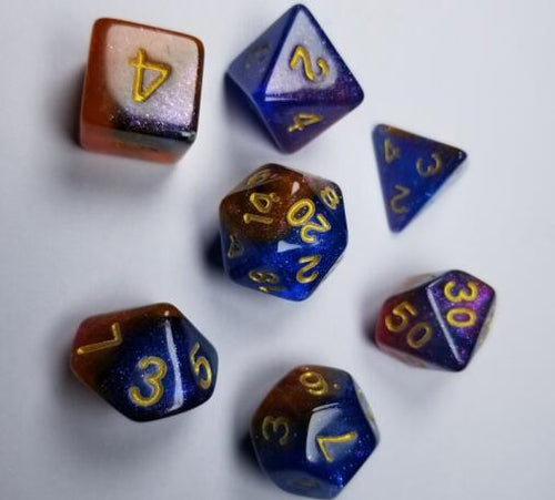 A tabletop dice set in two-tone red and blue, with gold numbers.