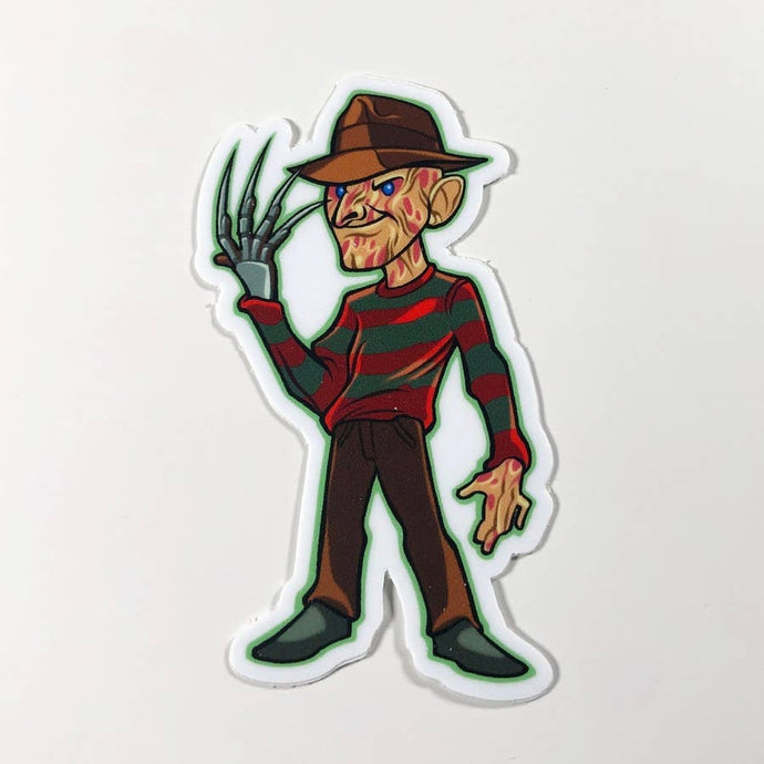 a caricature of a fullbodyFreddy Kreugor holding up his signature metal clawed hand with a smirk