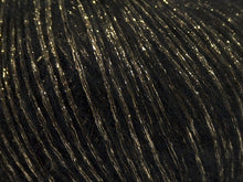 Load image into Gallery viewer, Closeup of black and gold yarn
