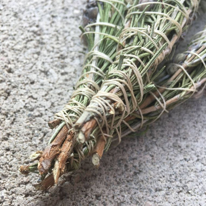 Rosemary sprigs and lavender wrapped together for smoke cleansing.