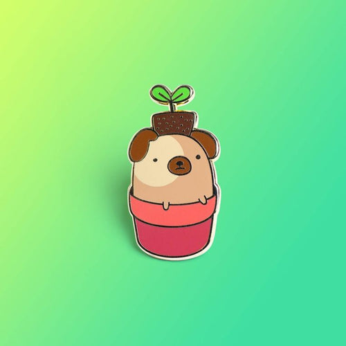 Enamel pin depicting a pug rising from a flower pot, with a plant sitting on its head.